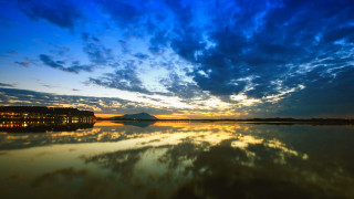 Lake sunset mountain clouds bridge - a sunset in the distance free wallpaper