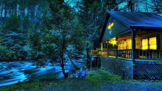 Cabin river night lit window - american romanticism free wallpaper for desktop