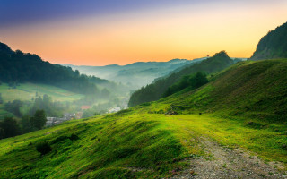 Grassy hill dirt path valley - a dirt path free wallpaper