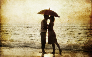 Romantic beach couple umbrella sunset - sunrise time free wallpaper for desktop