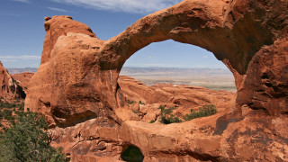 Large rock arch valley mountain - a large rock formation free wallpaper