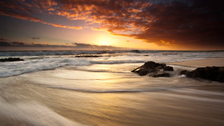Sunset ocean waves rock shore 2 - a sunset over the ocean free wallpaper