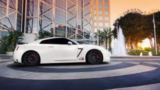 White sports car fountain sunset - a fountain in the background free wallpaper