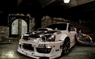 Man sitting ground white car 2 - gritty free wallpaper