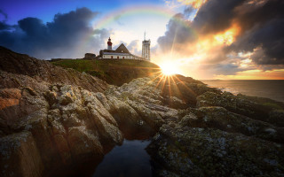 Lighthouse rocky cliff rainbow city - a rocky cliff free wallpaper