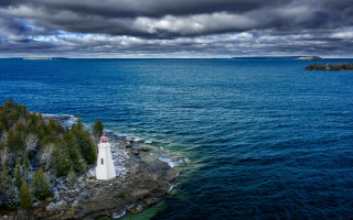 Lighthouse island ocean cloudy sky - a few cloud free wallpaper for desktop