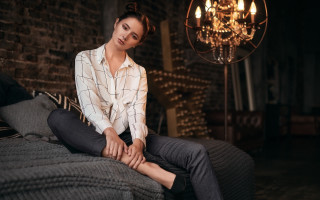 Woman sitting bed chandelier barbizon - a chandelier free wallpaper