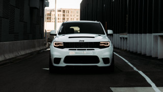 White jeep parking lot building - free cars wallpaper