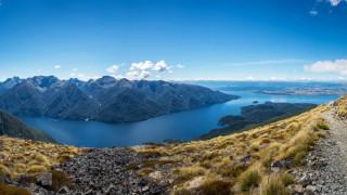 Mountain lake panorama blue sky - a lake in the middle of it free wallpaper for desktop