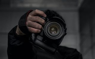 Man holding camera dark room 2 - new free wallpaper for desktop