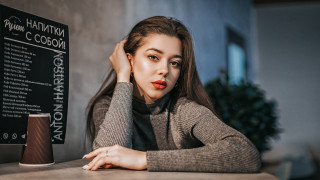 Woman table hand head sign - a woman sitting free wallpaper