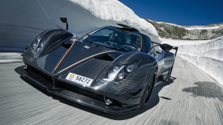 Black sports car mountain snow - spectacular free wallpaper