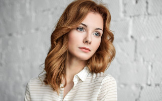 Redhair woman white shirt brickwall - a brick wall behind her free wallpaper