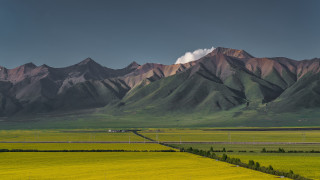 Green field mountains road fence - a large field free wallpaper