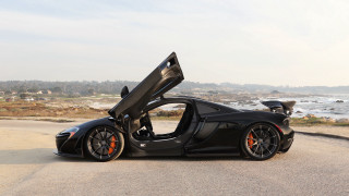 Black sports car ocean beach - free motorcycles wallpaper