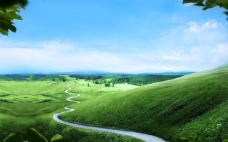 Winding road green valley blue 2 - a lush green valley free wallpaper