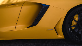 Yellow sports car black rim - a blue stripe free wallpaper for desktop