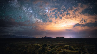 Night sky stars clouds mountains 4 - a mountain in the distance free wallpaper