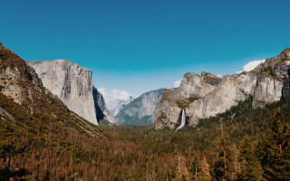 Mountain range valley forest cliff - a forest below free wallpaper