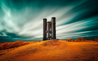 Tall tower green field cloudy - a lush green field under a cloudy sky free wallpaper