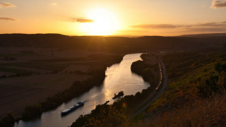 River boat sunset clouds mountain - a sunset in the background free wallpaper for desktop