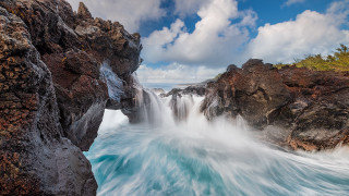 Waterfall cliff ocean beach clouds - the shore of a beach free wallpaper