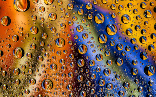 Water droplets rainbow background macro - a close up of water droplets free wallpaper for desktop