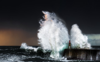 Lighthouse wave ocean beach cloud - a lighthouse in the distance free wallpaper