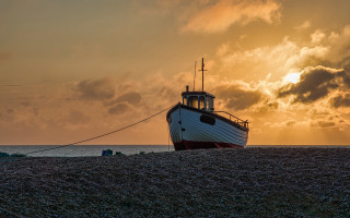Beach boat cloudy sunset fishing - a sandy beach under a cloudy sky free wallpaper