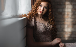 Redhead woman leaning window brickwall - a brick wall behind her free wallpaper
