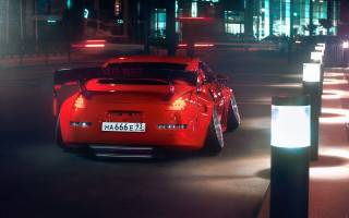 Red sports car night city 4 - a street light in the background free wallpaper
