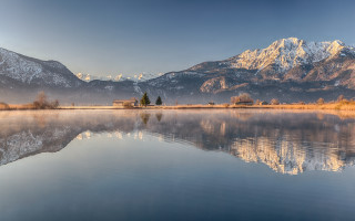 Lake house mountains sunset landscape - a house in the middle of it free wallpaper
