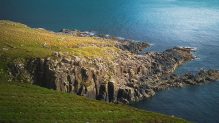 Rocky cliff waterfield grassland widescreen - a rocky cliff free wallpaper