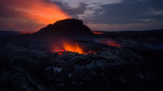 Lava orange glow mountain clouds - a dark cloud free wallpaper