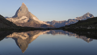 Mountain lake reflection symmetrical naturalism - the water below free wallpaper