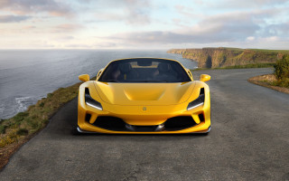 Yellow sports car ocean cliffs - a cliff in the background free wallpaper