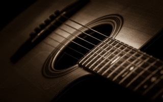 Guitar pen black background baroque - a close up of a guitar free wallpaper
