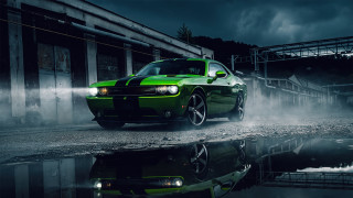 Green car puddle building dark - a green car free wallpaper