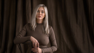 White haired woman brown shirt - a black chair free wallpaper