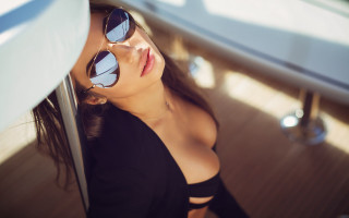 Woman sunglasses leaning wall sky - against a wall free wallpaper