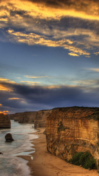 Beach cliff water cloudy sky - free landscape wallpaper for mobile