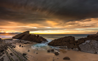 Beach rock formation water sunset - a few wave free wallpaper