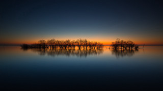 Sunset lake reflections trees sky - a sunset over a lake free wallpaper