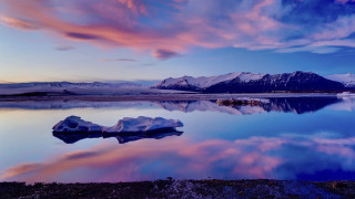 Iceberg lake mountains cloudy sky 3 - top of a lake under a cloudy sky free wallpaper