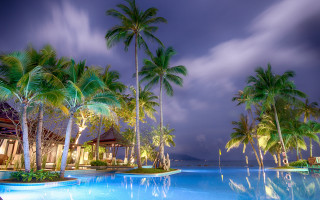 Pool palm trees beach house - a cloudy sky in the background free wallpaper for desktop