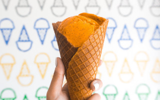 Person food cone colorful wall - a person holding free wallpaper