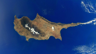 Large island ocean clouds sky - free space wallpaper