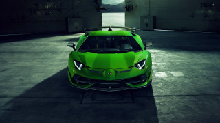 Green sports car parking lot 2 - a parking garage free wallpaper