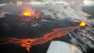Plane wing lava ocean flying - aerial free wallpaper