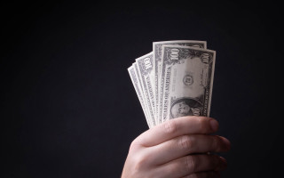 Money holding black background unreal - a black background behind them free wallpaper